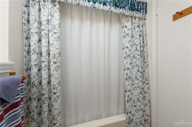 406 Sagittarius St, Mission, TX 78572 - bathroom with shower / bathtub combination with curtain