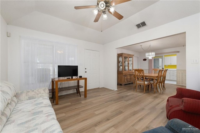 406 Sagittarius St, Mission, TX 78572 - living area with light wood finished floors, ceiling fan, and a chandelier