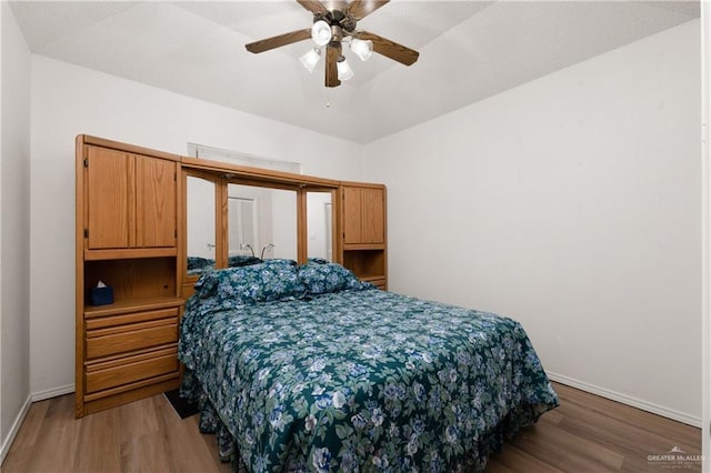 406 Sagittarius St, Mission, TX 78572 - bedroom featuring wood finished floors, baseboards, and a ceiling fan