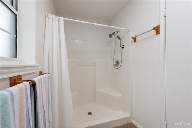 406 Sagittarius St, Mission, TX 78572 - bathroom featuring a shower with shower curtain