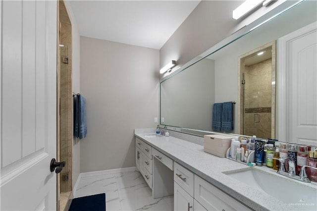 bathroom with vanity and a shower with shower door