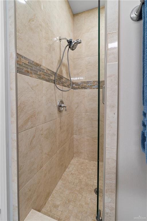 bathroom with a shower with shower door