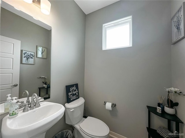 bathroom with sink and toilet