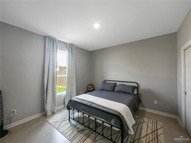 bedroom featuring light tile patterned floors