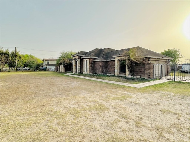 524 S Mile 2 W, Mercedes, TX 78570 - view of front of home featuring brick siding and fence