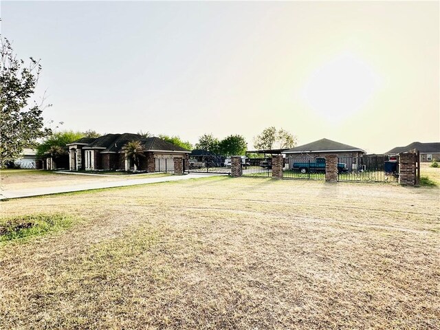524 S Mile 2 W, Mercedes, TX 78570 - view of yard featuring a garage and fence