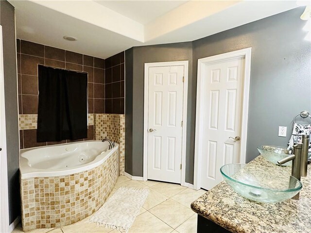 524 S Mile 2 W, Mercedes, TX 78570 - bathroom featuring tile patterned floors, vanity, baseboards, and a whirlpool tub