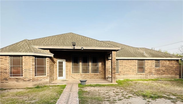 524 S Mile 2 W, Mercedes, TX 78570 - back of house with brick siding and a shingled roof