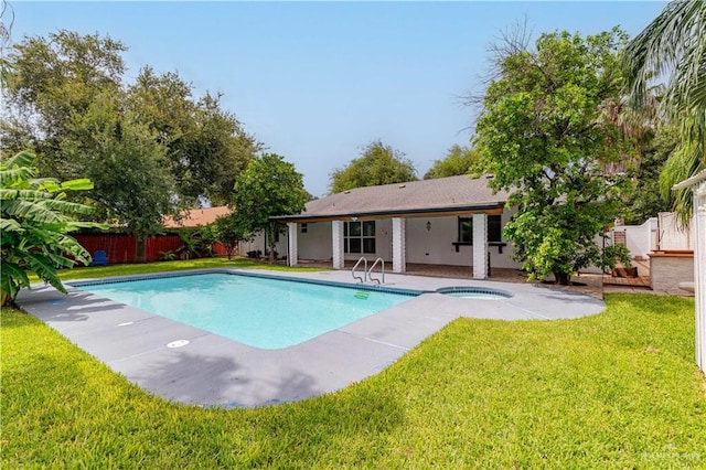 view of swimming pool featuring an in-ground hot tub and a patio area