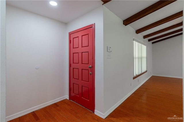 foyer entrance with beamed ceiling, wood finished floors, baseboards, and recessed lighting