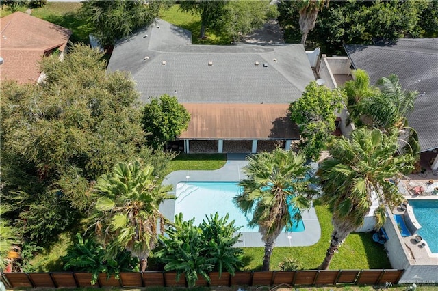 aerial view of property and surrounding area with a pool