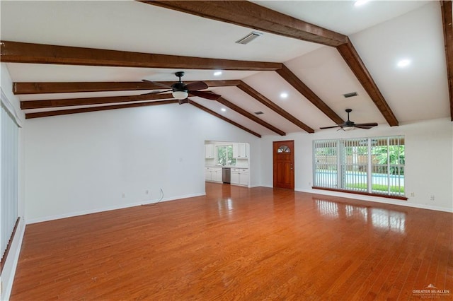unfurnished living room with ceiling fan, recessed lighting, healthy amount of natural light, and wood finished floors