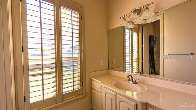 full bath featuring plenty of natural light and vanity