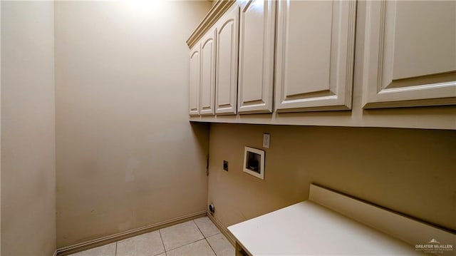 washroom featuring hookup for a washing machine, cabinet space, electric dryer hookup, and light tile patterned floors