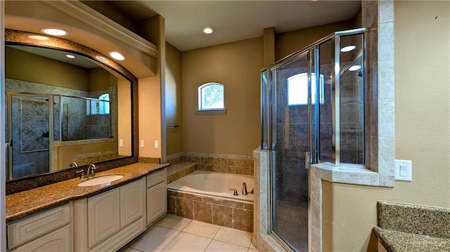 full bath with a garden tub, tile patterned flooring, vanity, and a shower stall