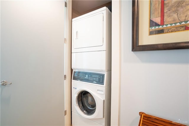 washroom with stacked washer / drying machine