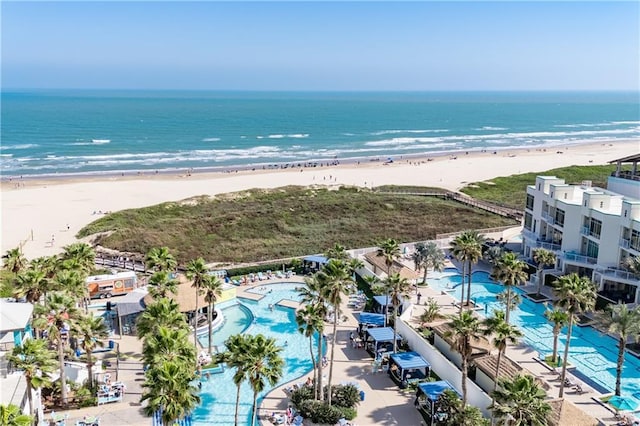 bird's eye view featuring a water view and a beach view