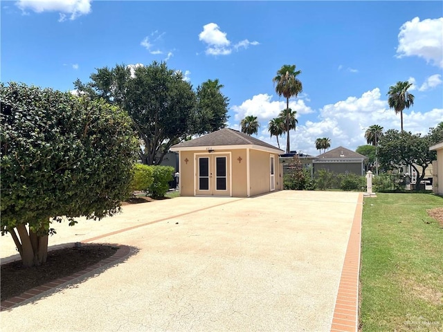 4014 Lark Dr, Mission, TX 78572 - view of outdoor structure featuring french doors and driveway