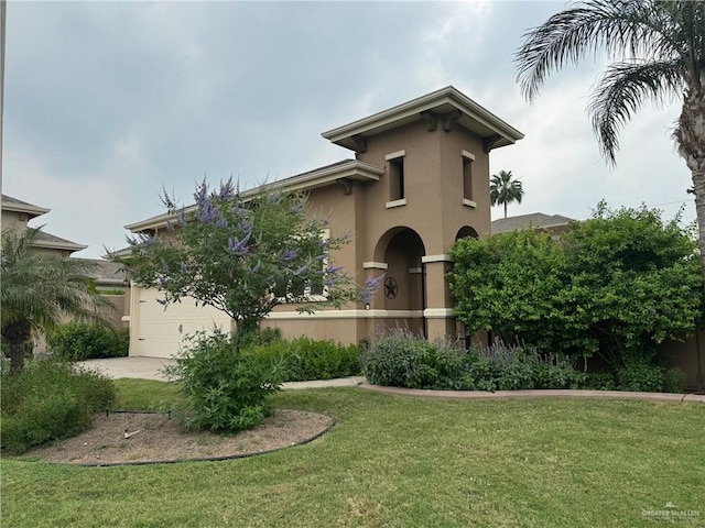 view of front of house with a garage and a front yard