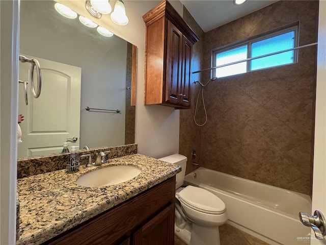 full bathroom featuring tile patterned flooring, vanity, toilet, and tiled shower / bath