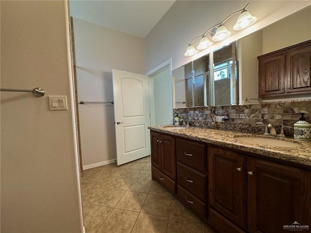 bathroom featuring vanity, tasteful backsplash, and tile patterned floors