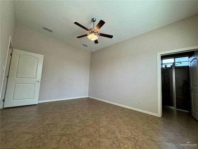 spare room featuring vaulted ceiling and ceiling fan