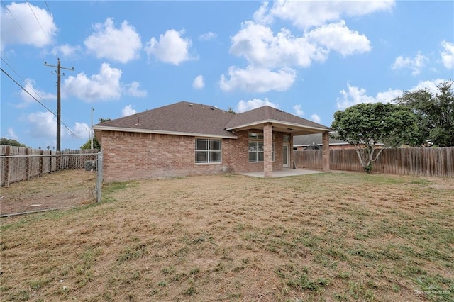3621 Xenops Ave, Mcallen, TX 78504 - rear view of property with a fenced backyard, a lawn, and a patio area