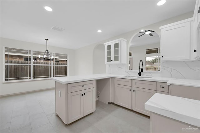 3621 Xenops Ave, Mcallen, TX 78504 - kitchen with a sink, hanging light fixtures, decorative backsplash, and recessed lighting