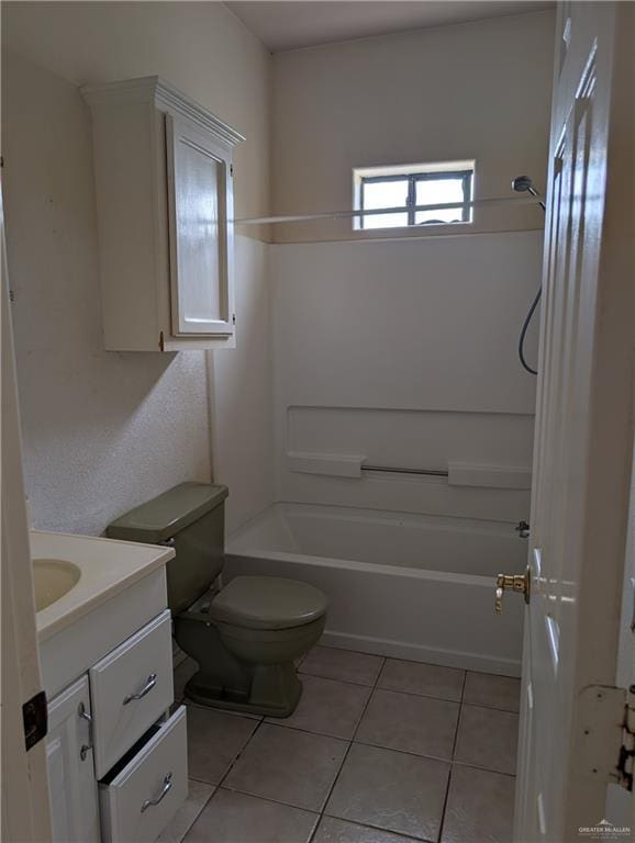 bathroom featuring toilet, washtub / shower combination, tile patterned flooring, and vanity