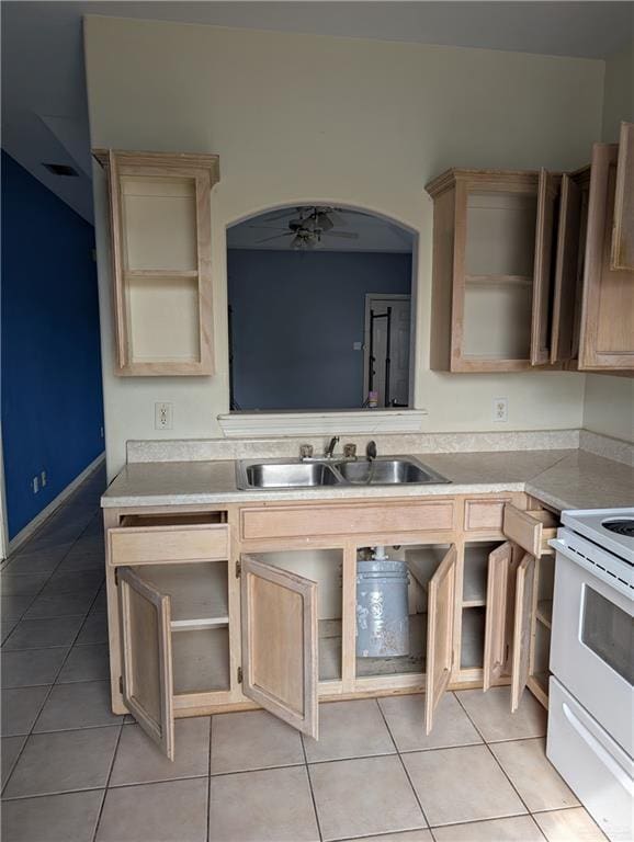 kitchen with light tile patterned floors, white electric stove, a ceiling fan, light countertops, and a sink