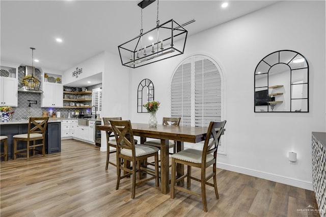 dining room featuring hardwood / wood-style flooring and beverage cooler