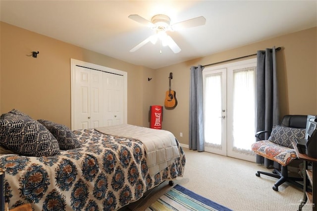 carpeted bedroom with ceiling fan and a closet