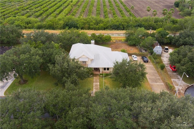 birds eye view of property with a rural view