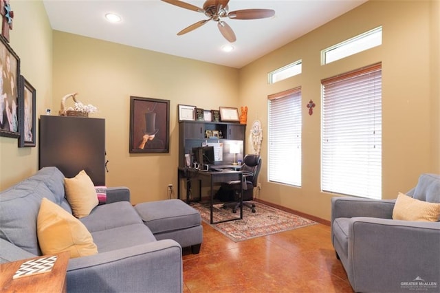 office area with ceiling fan and concrete floors