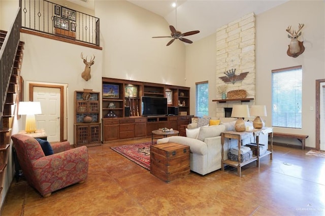 living room featuring ceiling fan and high vaulted ceiling