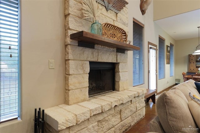 living room with a healthy amount of sunlight and a fireplace