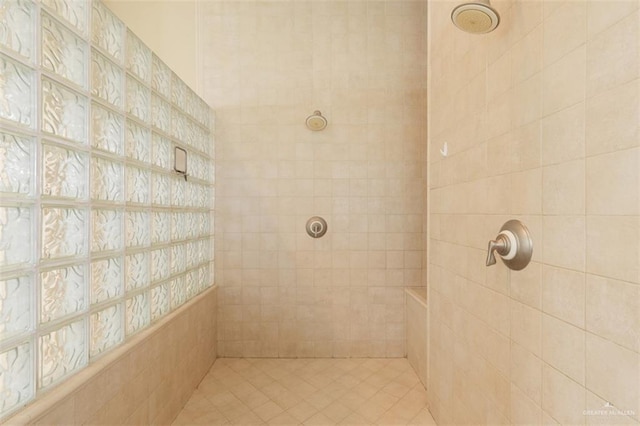 bathroom with a tile shower