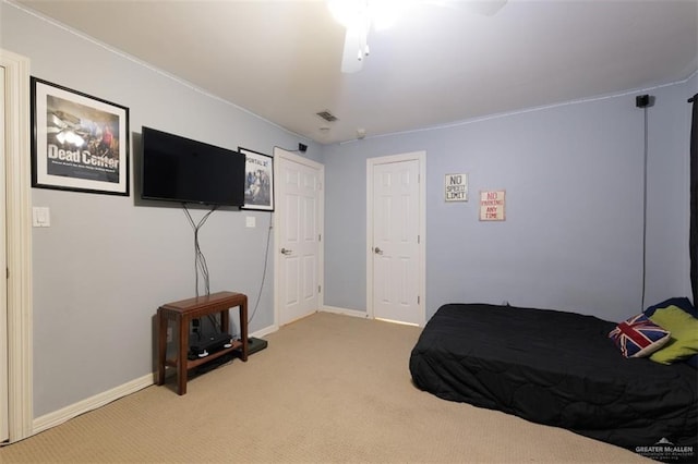 bedroom with ceiling fan and carpet floors