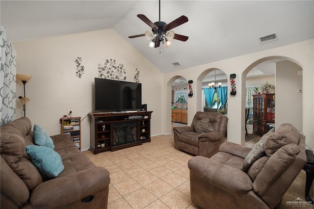 living room featuring ceiling fan with notable chandelier, high vaulted ceiling, and light tile patterned flooring