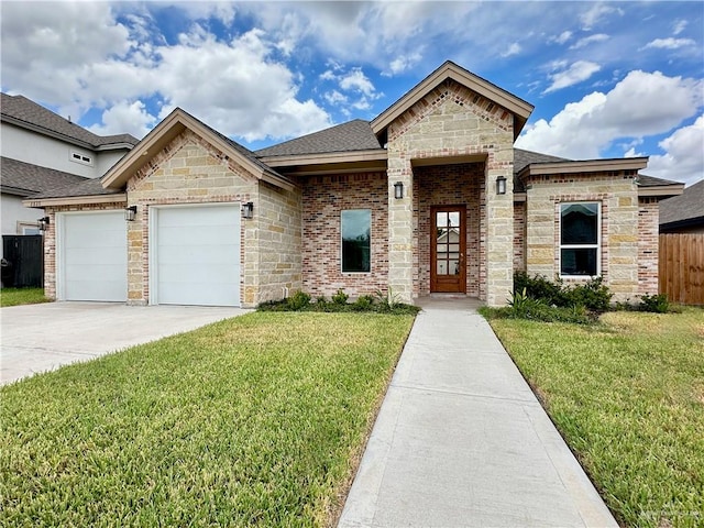 view of front of property featuring a front yard and a garage