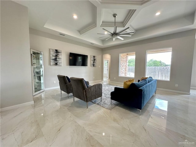 living room with ceiling fan, beamed ceiling, and coffered ceiling