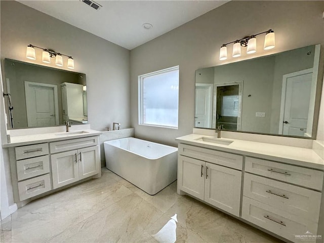 bathroom with a bathtub and vanity