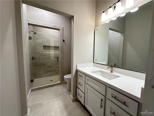 bathroom with vanity, a shower with shower door, and toilet