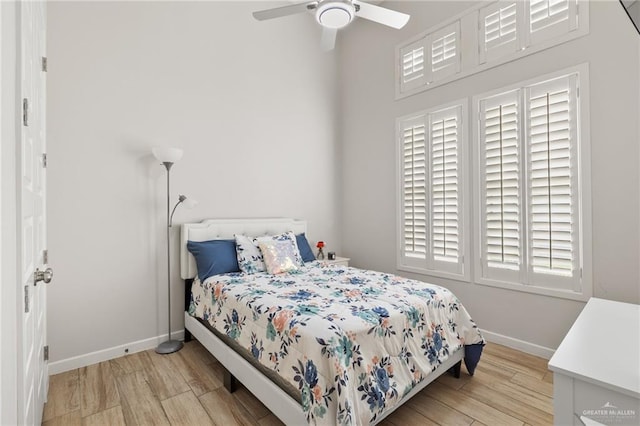 bedroom featuring ceiling fan and light hardwood / wood-style floors