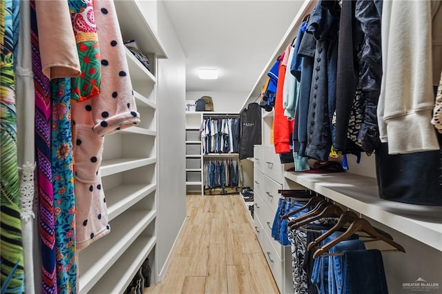 spacious closet featuring light hardwood / wood-style flooring