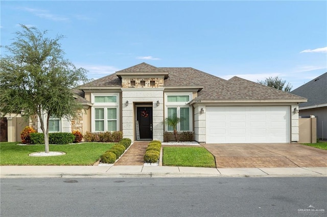 view of front facade featuring a garage and a front yard