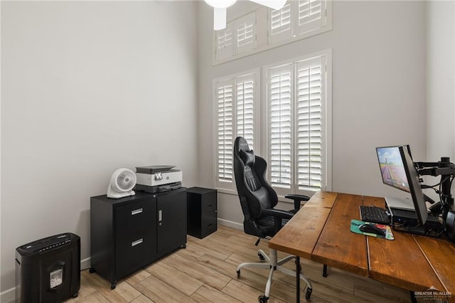 office featuring a healthy amount of sunlight and light hardwood / wood-style flooring