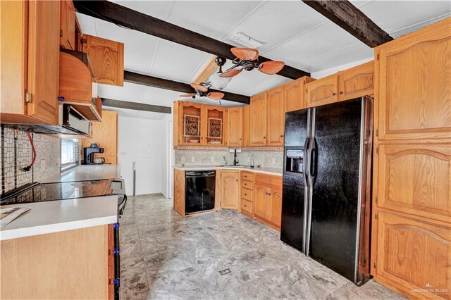 kitchen with a ceiling fan, light countertops, beam ceiling, black appliances, and glass insert cabinets