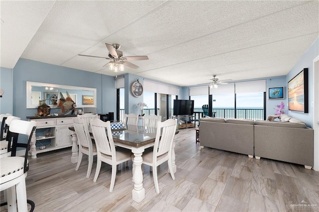 3000 Gulf Blvd Unit 701, South Padre Island, TX 78597 - dining room with ceiling fan and a textured ceiling