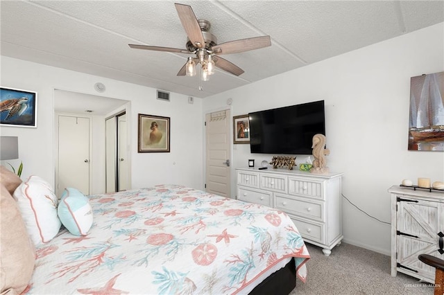 3000 Gulf Blvd Unit 701, South Padre Island, TX 78597 - bedroom featuring light colored carpet and a ceiling fan
